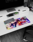 Anime mouse pad 28x12 inches featuring Megumin and Komekko from KonoSuba, vibrant purples, pinks, and golden flares.