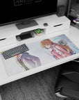 36x16 inches anime desk pad showing distant couple in snowfall, blonde girl in pink coat, boy looking away.
