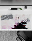 Anime mouse pad featuring Kaneki from Tokyo Ghoul with a sinister smile, snowy chaos, and red eye, sized 32x16 inches.