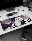 Artistic 36x16 inches desk pad featuring Tanjiro and Nezuko Kamado with striking contrasts and fierce expressions, ideal for bold anime lovers.