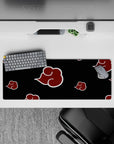 32x12 inches Naruto mouse pad in villain-core style: crimson clouds with white outlines on black.