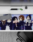 Cozy snowy night anime desk pad 36x16 inches in soft blues and violet glow with bright scarves.