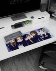 Yui Hirasawa and friends giggling in dark coats, heart bag detail anime girl mouse pad 32x12 inches.