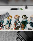 Cheerful teal-and-white anime desk pad 40x20 inches with warm guitar reds and cozy chaotic vibes.