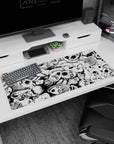36x16 inches anime desk pad showing a swirling pile of skull-mask faces and hollow eyes in a gritty scene.
