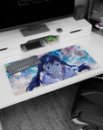 32x16 inches mouse pad showing a sapphire-eyed anime girl with twin braids leaning in to cheer you on.