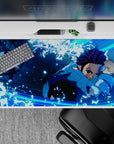 Vibrant 40x20 inch anime desk pad showcasing Tanjiro's fluid motion and intense action for powerful visual lovers