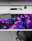 36x16 inches anime desk pad in rich violet tones, dreamy late-night romance vibe with soft glow and flowers.