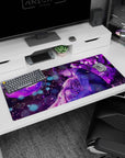36x16 inches anime desk pad showing dark-haired boy holding a tearful girl close as petals drift at night.
