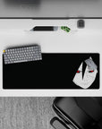 Dark black Naruto desk mat with pale face and red Sharingan eyes, moody vibe, 32x12 inches.