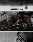 Dark and dynamic 40x20 inch anime desk pad showcasing Guts in battle-ready pose with intricate armor details