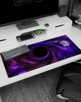 Violet clouds spiraling into a dark center desk pad 36x16 inches, like a star-filled portal scene.