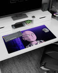 32x16 inches anime mouse pad showing Saitama staring ahead, bald head and cape clasp lit against purple structures.