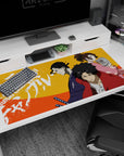 40x20 inches anime desk pad showing red haori fighter front, indigo swordsman side-on, pink girl warning.
