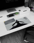 Lone final-boss armored figure with arms spread on anime mouse pad 28x12 inches, swirling smoke below.