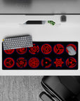 32x12 inches desk mat in deep crimson and black with glowing blue rims, dark and menacing Sharingan vibe.