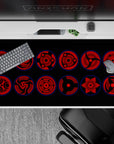 40x20 inches desk pad in deep crimson and black with glowing blue rims, sleek menacing Sharingan vibe.