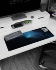 Star-speckled space scene 32x12 inches mouse pad with icy streaks through dark nebula clouds.