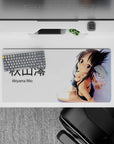 Soft glow skin highlights, dark hair, and flirty shy vibe anime desk mat in black and white, 32x16 inches.