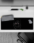 32x12 inches black desk mat with crisp white sketch and neon red eyes, calm before the storm mood.