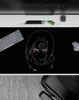 Dark black 40x20 inches anime desk pad with calm, dangerous vibe, glowing red eyes and clean glide.