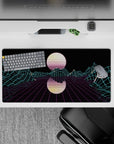 32x16 inches mouse pad with Neon Grid Mirage, showcasing a retro-futuristic grid landscape and glowing mountains beneath a mirrored sun.
