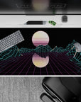 40x20 inches desk pad with Neon Grid Mirage, showcasing a retro-futuristic grid landscape with glowing mountains and a mirrored sun for a digital aesthetic.