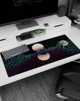 Artistic 36x16 inches desk pad featuring Neon Grid Mirage, blending glowing mountains and a grid landscape for a retro-futuristic digital design.