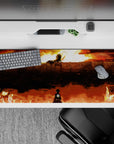 Attack on Titan desk pad 36x16 inches featuring Eren facing the Colossal Titan at Wall Maria, fiery sky backdrop.