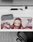 Nezuko anime mouse pad, 32x12 inches, featuring her starlit eyes, pink highlights, and flowing hair for an inspiring workspace.