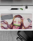 Mouse pad 32x16 inches featuring Nezuko from Demon Slayer with starlit eyes, pink highlights, and gentle sparkles.