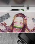 Desk pad 40x20 inches featuring Nezuko from Demon Slayer with starlit eyes, pink highlights, and gentle sparkles.