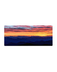 Mouse pad featuring a vibrant sunset with serene mountains, 28x12 inches, for a peaceful, nature-inspired workspace.