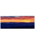 Compact 32x12 inches mouse pad with a vibrant sunset and serene mountains, blending fiery skies for a calming workspace look.
