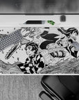 Dynamic 40x20 inch anime desk pad showcasing Tanjiro and Nezuko's determination and strength in action