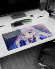 32x16 inches anime desk mat showing a shy girl with sapphire eyes and X hairpins amid drifting petals.