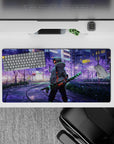 Anime mouse pad 32x16 inches featuring Tanjiro from Demon Slayer in neon-lit city with sakura tones and iconic blade.