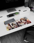 28x12 inches anime girl mouse pad showing four blushing schoolgirls guarding a steaming bowl on a train.