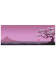 Compact 32x12 inches mouse pad with Blossom Horizon, featuring a peaceful cherry blossom tree and pink sunset with distant mountains for serenity.
