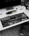 Artistic 36x16 inches desk pad featuring terrifying creatures from Berserk, ideal for adding dark, intense, and intricate artwork to your workspace.