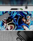 Dynamic 40x20 inch anime desk pad showcasing fusion warriors Gogeta and Vegito in powerful poses