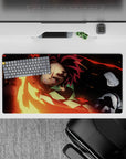 Tanjiro from Demon Slayer unleashes fiery sword swing on 32x16 inch anime mouse pad, vivid reds and golds.