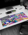 36x16 inches anime girl mouse pad showing four cute girls laughing through bright paint bursts and sparkles.