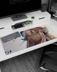 36x16 inches Made in Abyss desk pad featuring Nanachi in soft fur tones, teary eyes, and drifting green leaves.