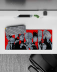 Compact 28x12 mouse pad featuring Jujutsu Kaisen sorcerers with energetic black and red design for fans
