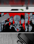 Dynamic 40x20 desk pad showcasing Jujutsu Kaisen sorcerers in striking black and red design for fans
