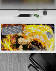32x16 inches anime mouse pad in blazing gold and orange swirls, bold paint-splash action vibe.