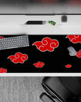 Naruto-inspired dark mood desk pad, 36x16 inches, deep black with bold red clouds and crisp swirls.