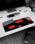 Naruto Akatsuki Itachi-inspired red clouds desk mouse pad 32x12 inches for collectors and gamers.