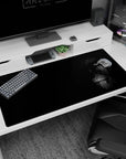 Eren’s Founding Titan anime desk pad, 40x20 inches, features a striking black-and-white design with a piercing gaze.
